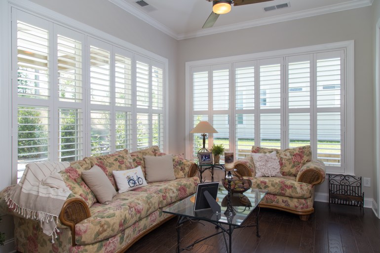 Traditional sunroom with plantation shutters in Miami.